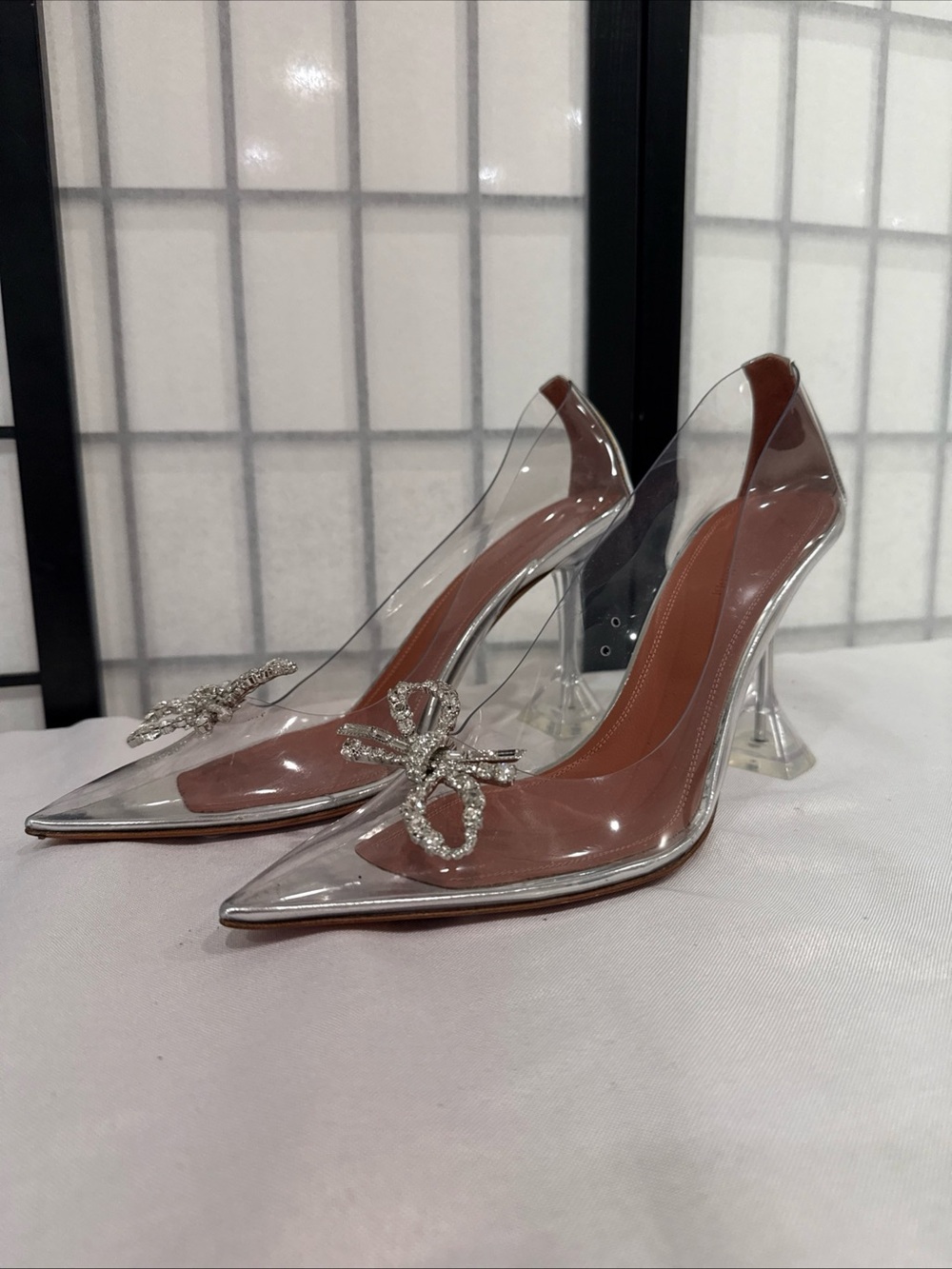 Amina Muaddi Clear PVC Pointed Pumps with Pink-Tan Insole & Crystal Bow